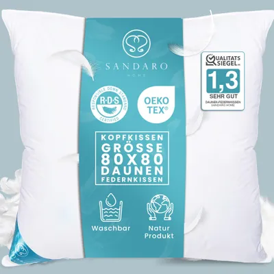A white pillow with a teal label in the center, featuring product information and certifications.