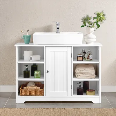 A white bathroom vanity with a sink and various bathroom accessories.