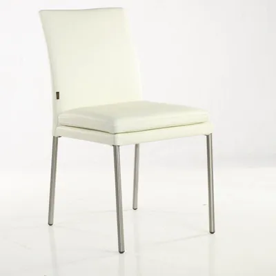 A single white leather dining chair with a silver metal frame is shown against a white background.
