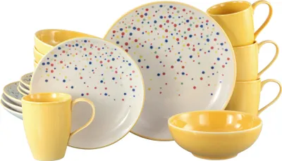 A set of yellow and white ceramic dishes with colorful polka dots, including plates, bowls, and mugs, arranged on a white background.