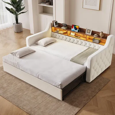Immagine prodotto di Divano letto 90x190 cm con meccanismo letto estraibile, rivestimento in velluto, testiera con vano contenitore e ripiano in legno, illuminazione LED, porte USB e Type-C, braccioli e rete a doghe, colore beige