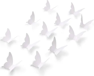 A collection of white paper butterflies arranged on a white background.