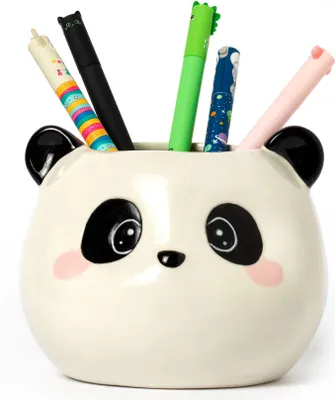 A ceramic panda-shaped pen holder filled with colorful pens.
