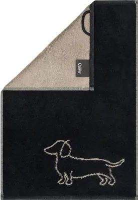 A folded towel with a dachshund embroidered on it.