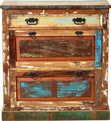 A close-up, front-facing view of a rustic, multi-colored wooden cabinet with drawers and doors.