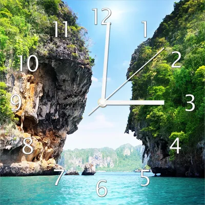 Produktbild von Wallario Design Wanduhr Felsenschlucht am Meer in Thailand aus Echtglas, Größe 30 x 30 cm