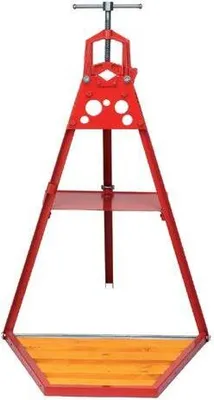 A red pipe vise stand on a white background.