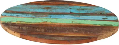A round tabletop made of reclaimed wood planks with various natural wood tones and painted sections of blue and green.