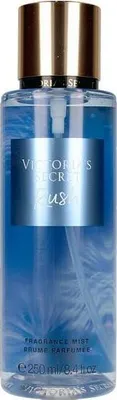 A close-up studio shot of a Victoria's Secret fragrance mist bottle.