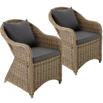 Two wicker armchairs with gray cushions are shown against a white background.
