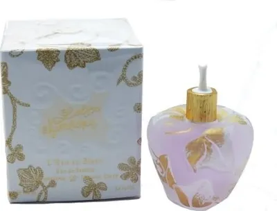 A perfume bottle and its box are displayed against a white background.
