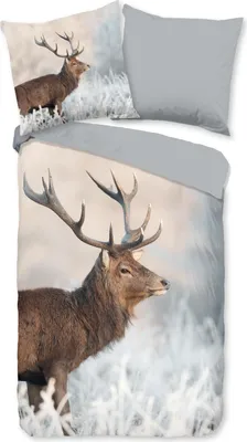 A duvet cover set featuring a realistic image of a reindeer in a snowy landscape.