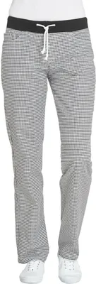 A person wearing checkered pants and white sneakers against a white background.