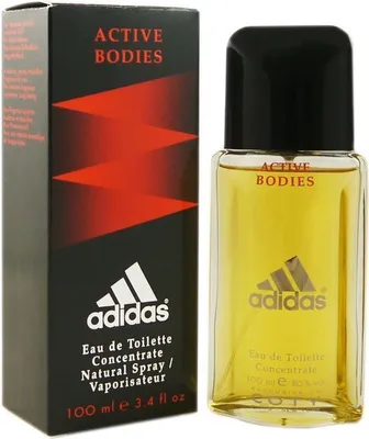 A product shot of Adidas Active Bodies Eau de Toilette for men, with its packaging. The product is a clear glass bottle with yellow liquid, a black cap, and the Adidas logo. The packaging is a black box with red geometric designs and the Adidas logo.