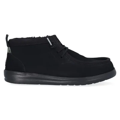 A single black shoe on a white background.