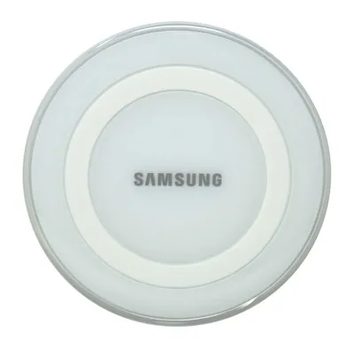 A top-down view of a white Samsung wireless charger.