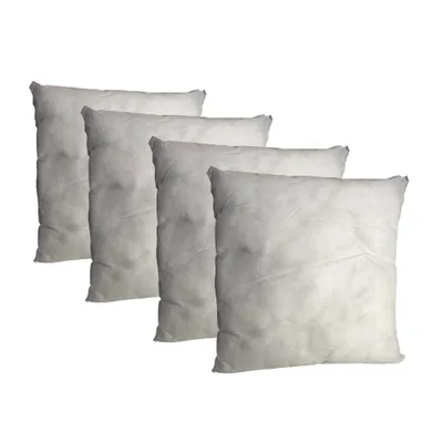 Four white pillow inserts are arranged diagonally on a white background.