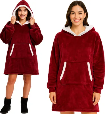 Two women modeling a red hoodie blanket.