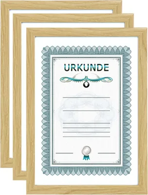 Three framed certificates are stacked on top of each other, with the frontmost certificate clearly visible.