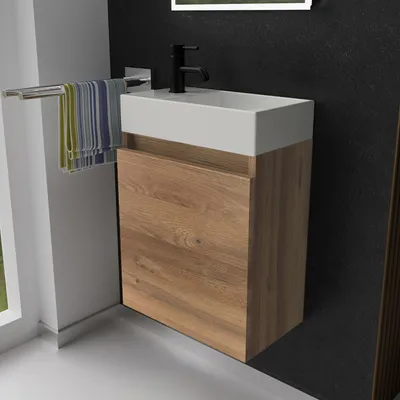 A modern bathroom vanity with a sink and cabinet.