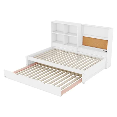 A white multifunctional sofa with a pull-out guest bed, storage shelves, and a corkboard.