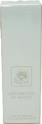 A close-up of a white perfume box with embossed floral design and text.
