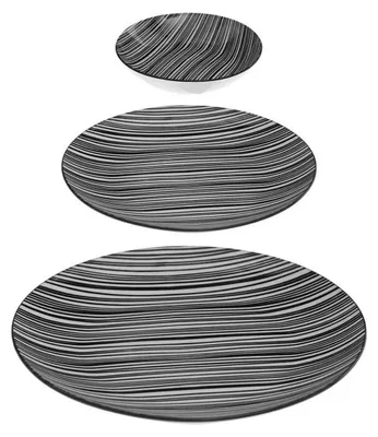 Three plates of varying sizes are stacked on a white background. Each plate has a black and white striped pattern.