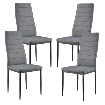 Four dining chairs arranged in a studio setting against a white background.