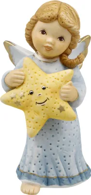 A ceramic figurine of an angel holding a star.