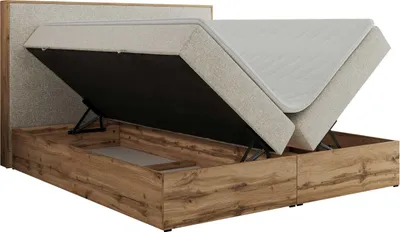 A bed with its storage compartment open, showing the mattress and the wooden frame.