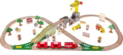 A wooden train set with various accessories, including a crane, vehicles, animals, and figures, arranged on a white background.