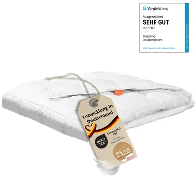 A folded white duvet with a tag attached by string.