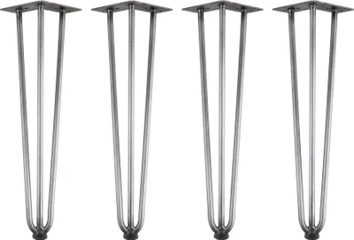 Four metal table legs on a white background.