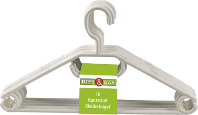 A stack of white plastic clothes hangers with a product tag.