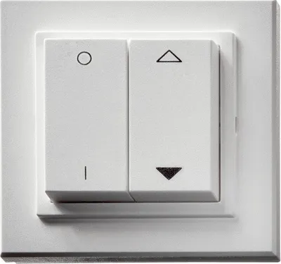 A close-up view of a white double light switch with symbols on the buttons.