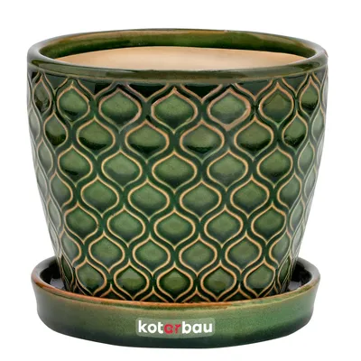 A green ceramic plant pot with a decorative pattern and a matching saucer, set against a white background.