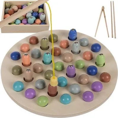 A wooden fishing game with colorful magnetic fish and a fishing rod, laid out on a circular board.