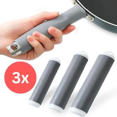 A hand holding a pan handle with a silicone grip, and three silicone grips laid out in front.