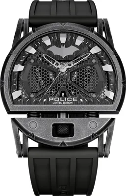 A close-up studio shot of a dark-colored men's watch with a Batman-themed design.
