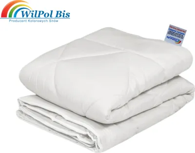 A folded white duvet is shown against a white background, with a brand logo and text in the upper left corner and a product tag on the duvet.