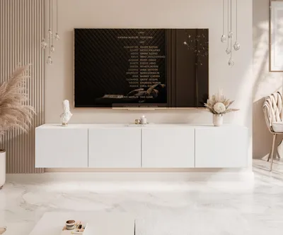 A modern living room with a wall-mounted TV cabinet and a large television screen.