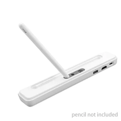 A white Apple Pencil is shown resting in a white charging and hub accessory. The accessory has USB ports and a charging port visible.