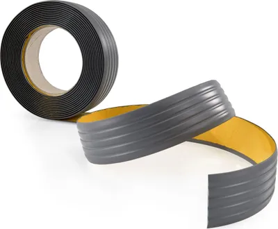 A roll of dark gray anti-slip tape with a yellow adhesive backing is shown. A portion of the tape is unrolled, revealing its ribbed texture.