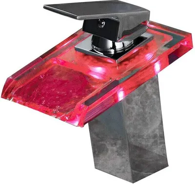 A close-up studio shot of a modern LED faucet with a waterfall spout and a gray stone-like base.