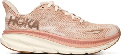 A side view of a single pink Hoka One One running shoe against a white background.
