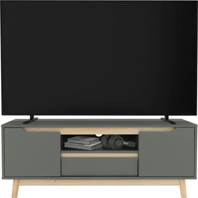 A modern TV stand with a television on top.