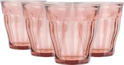 Four pink glasses are arranged in a group on a white background.