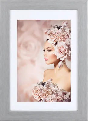 A woman adorned with flowers, presented in a framed image.