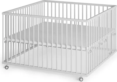 A white playpen with a white mattress inside, shown from a diagonal angle.