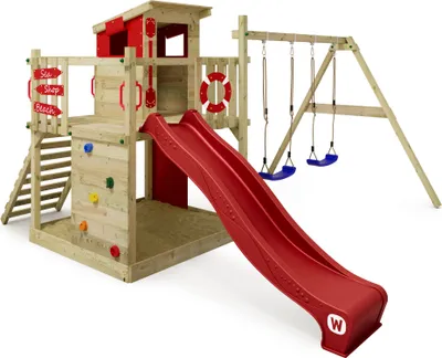 A wooden playground set with a slide, swings, climbing wall, and sandpit.